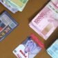 Polisi mengamankan barang bukti berupa uang tunai sebesar 10 juta rupiah, 2 ID Card Media , 2 unit Handphone dan 1 Unit Mobil. (Dok. Polres Bogor)